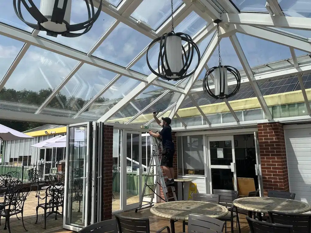 Interior conservatory roof and finials being cleaned